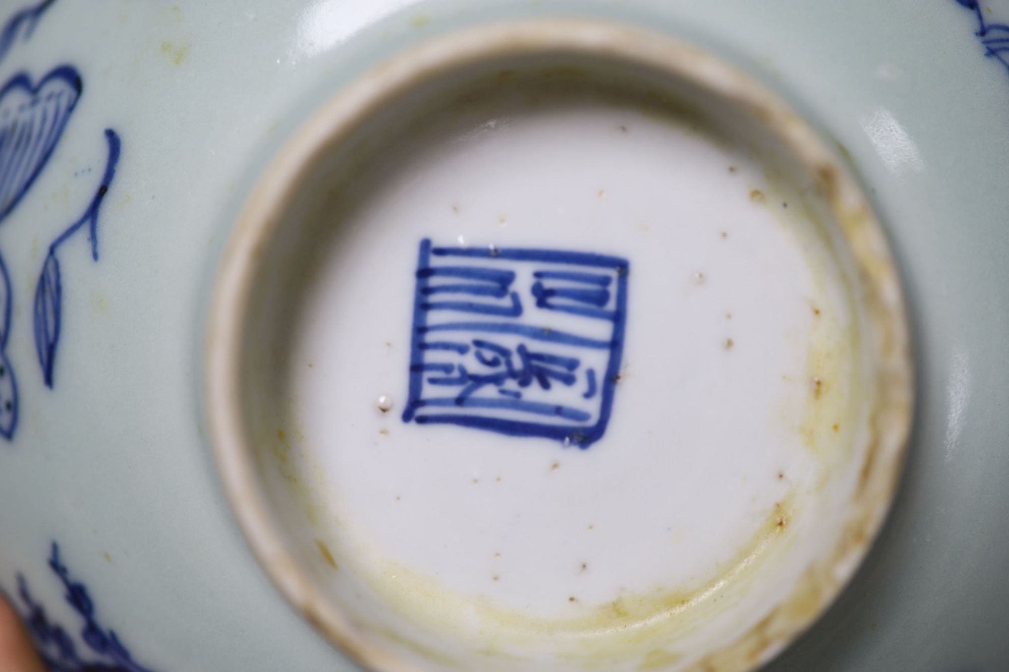 A Chinese famille rose teapot and sucrier, a 19th century Chinese bowl and a pair of blue and white bowls